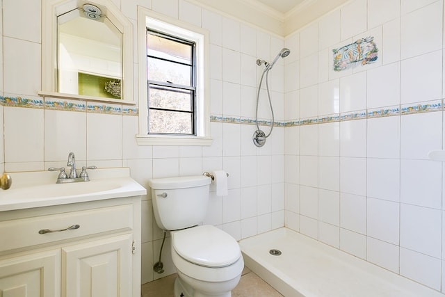 full bathroom featuring crown molding, tile walls, toilet, a tile shower, and vanity