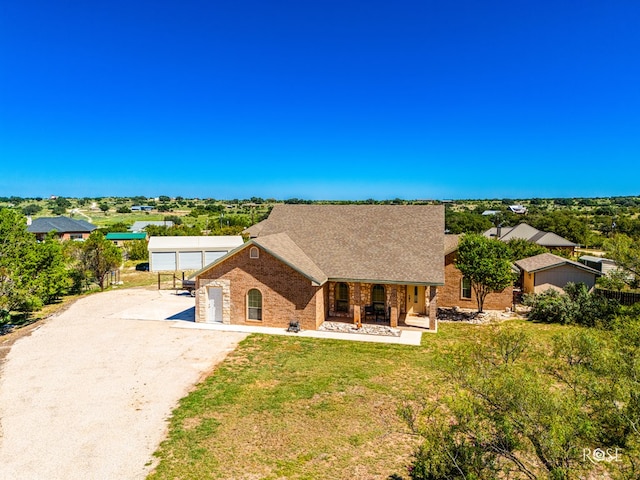 view of front of property with a garage and a front lawn