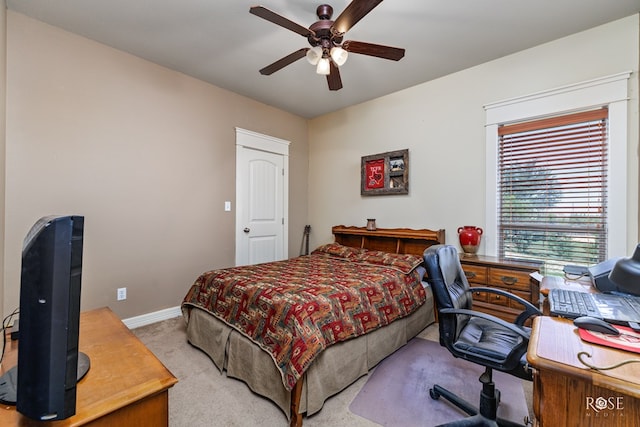 bedroom with light colored carpet and ceiling fan