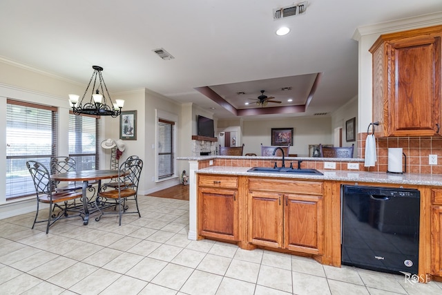 kitchen featuring a raised ceiling, ornamental molding, black dishwasher, and sink