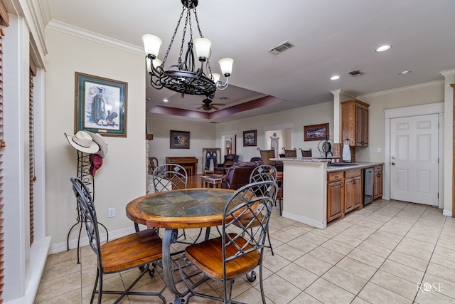 dining space with light tile patterned floors, ornamental molding, and sink