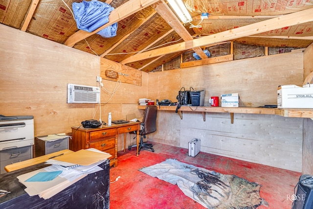 office area with lofted ceiling and a wall unit AC