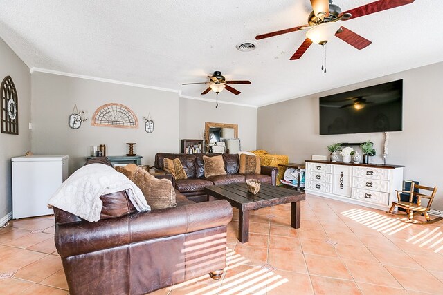 tiled living room with crown molding, ceiling fan, and a textured ceiling