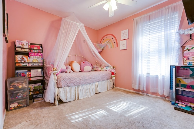 carpeted bedroom with ceiling fan