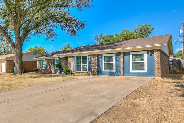 ranch-style home with a front yard