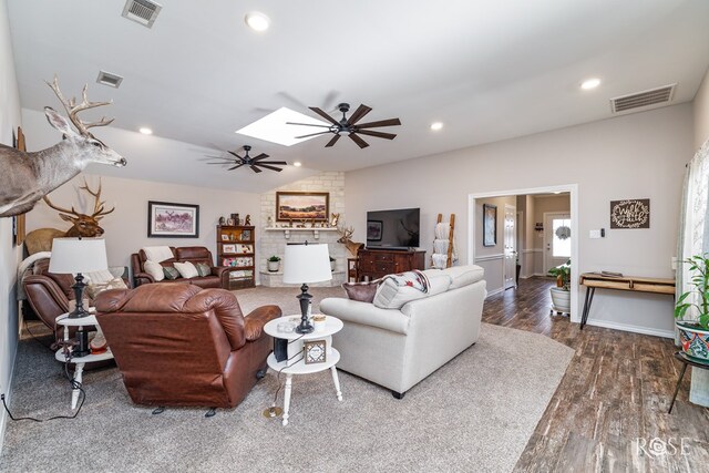 4137 Sedona Trl, San Angelo, TX 76904 - living room with a ceiling fan, wood finished floors, a skylight, recessed lighting, and lofted ceiling