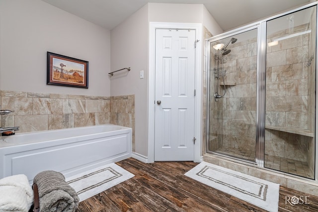4137 Sedona Trl, San Angelo, TX 76904 - bathroom featuring a shower stall, wood finished floors, and a garden tub