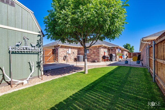 4137 Sedona Trl, San Angelo, TX 76904 - view of yard with a patio area, a gate, and central air condition unit