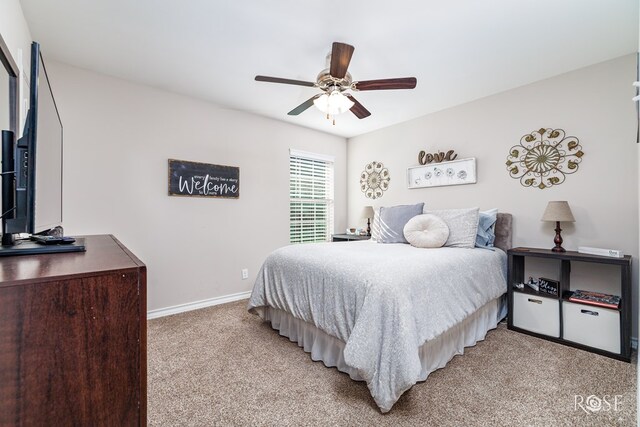 4137 Sedona Trl, San Angelo, TX 76904 - bedroom with light colored carpet, baseboards, and ceiling fan