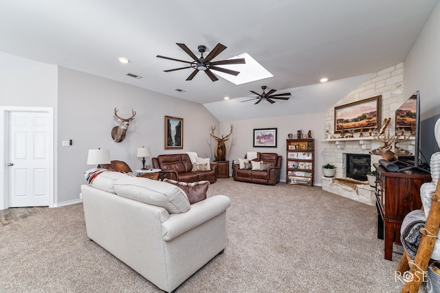 4137 Sedona Trl, San Angelo, TX 76904 - living area with carpet flooring, ceiling fan, a fireplace, lofted ceiling, and a skylight