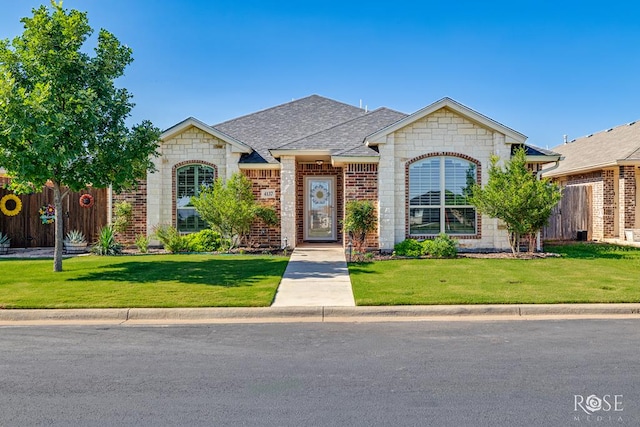4137 Sedona Trl, San Angelo, TX 76904 - french provincial home featuring brick siding, a shingled roof, and stone siding