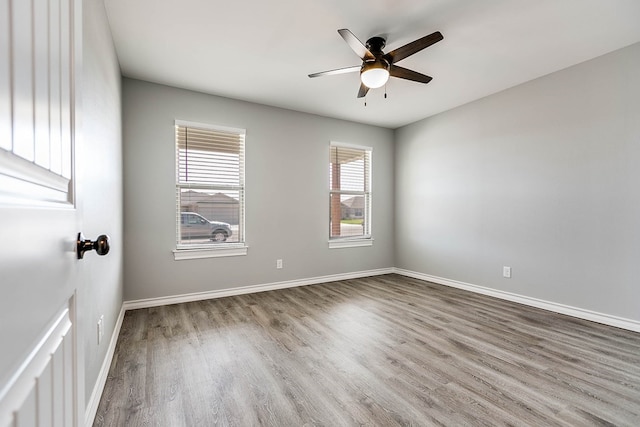 2822 Joshua St, San Angelo, TX 76905 - spare room featuring wood finished floors, ceiling fan, and baseboards