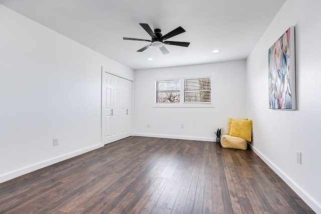 unfurnished bedroom featuring dark wood finished floors, recessed lighting, a closet, a ceiling fan, and baseboards