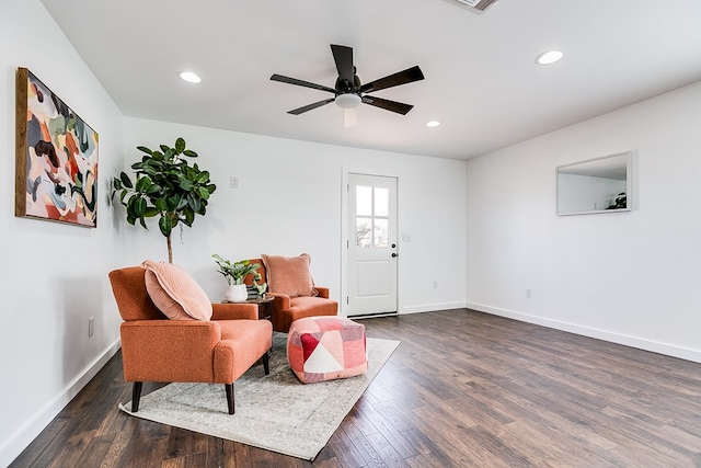 sitting room featuring dark wood-style floors, ceiling fan, recessed lighting, and baseboards