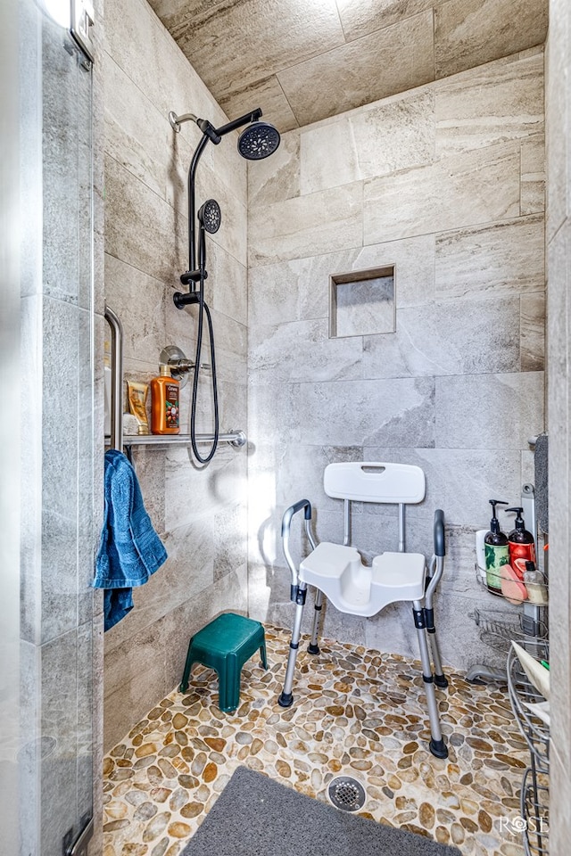 bathroom with a tile shower