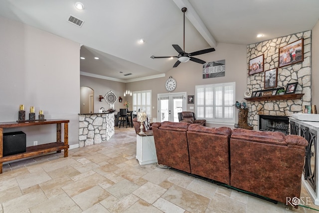 living room with ceiling fan, beam ceiling, high vaulted ceiling, a stone fireplace, and french doors