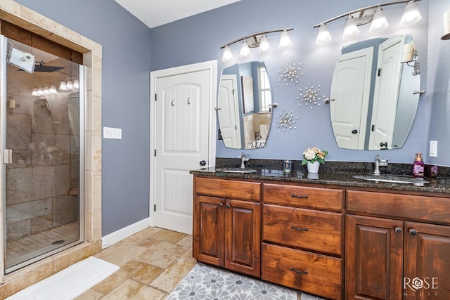 bathroom featuring vanity and an enclosed shower