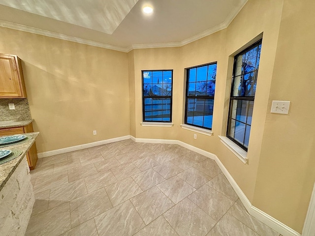 2110 Shelton St, San Angelo, TX 76903 - unfurnished dining area featuring ornamental molding and baseboards
