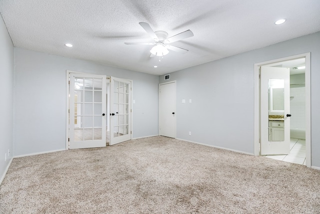 carpeted spare room featuring visible vents, ceiling fan, a textured ceiling, french doors, and recessed lighting