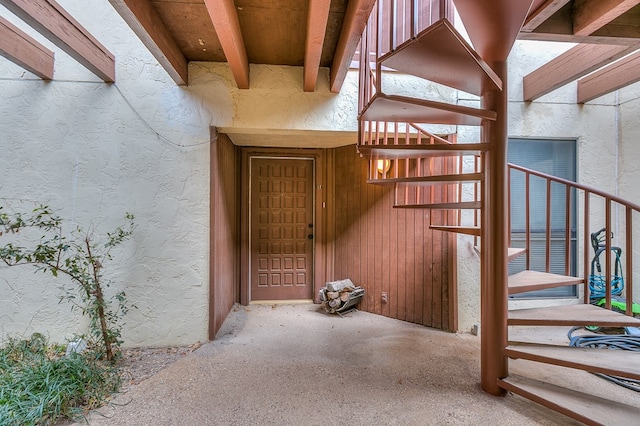 doorway to property with stucco siding