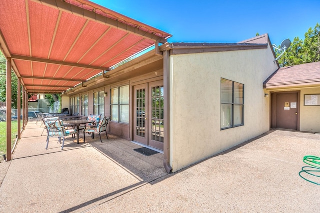 view of patio / terrace with french doors and outdoor dining area