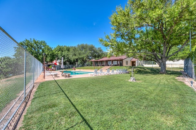 view of yard with a patio area, a fenced backyard, and a fenced in pool