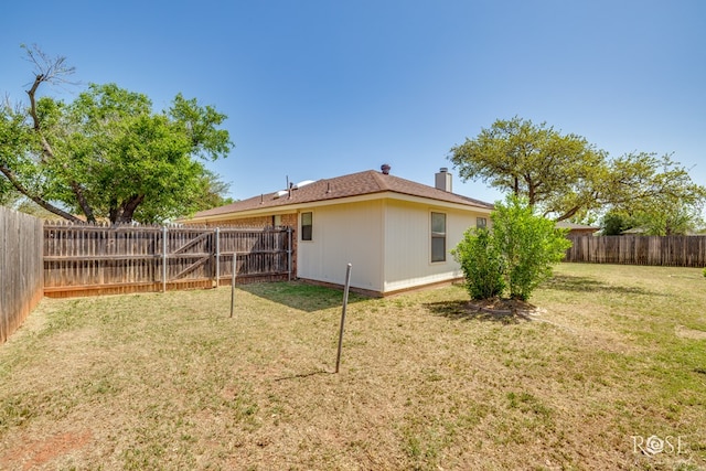 view of yard with a fenced backyard