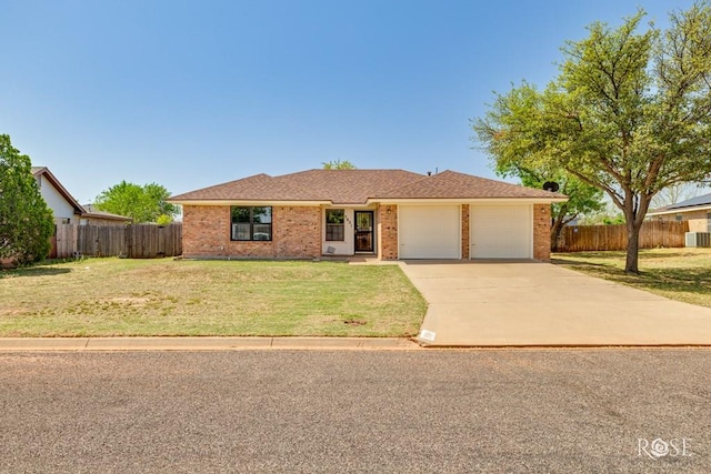 ranch-style home with brick siding, a garage, a front lawn, and fence
