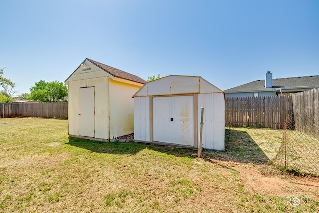 view of shed with a fenced backyard