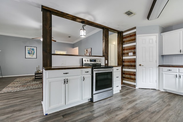 kitchen with decorative light fixtures, stainless steel electric range, ornamental molding, dark hardwood / wood-style flooring, and white cabinets