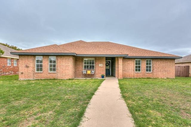 ranch-style house with a front lawn