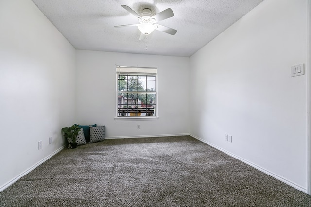 carpeted spare room with ceiling fan and a textured ceiling