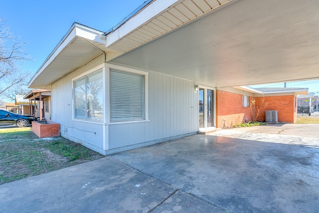 2729 Rio Grande St, San Angelo, TX 76904 - view of home's exterior featuring cooling unit, a carport, and a patio