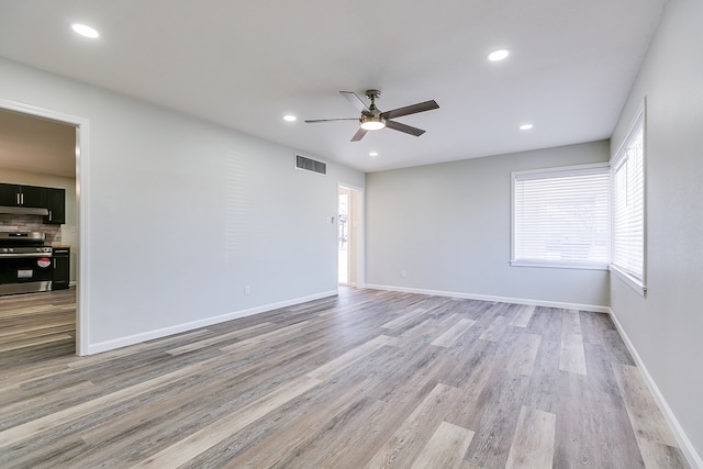 2729 Rio Grande St, San Angelo, TX 76904 - spare room with a ceiling fan, light wood-style flooring, recessed lighting, and baseboards