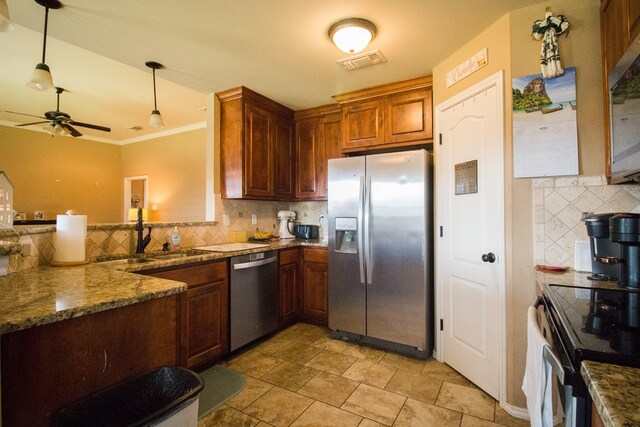 4154 Huntleigh Dr, San Angelo, TX 76904 - kitchen featuring appliances with stainless steel finishes, a sink, backsplash, a ceiling fan, and dark stone counters