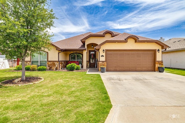 5922 Tarin St, San Angelo, TX 76904 - view of front of property featuring stucco siding, stone siding, a garage, concrete driveway, and a front lawn
