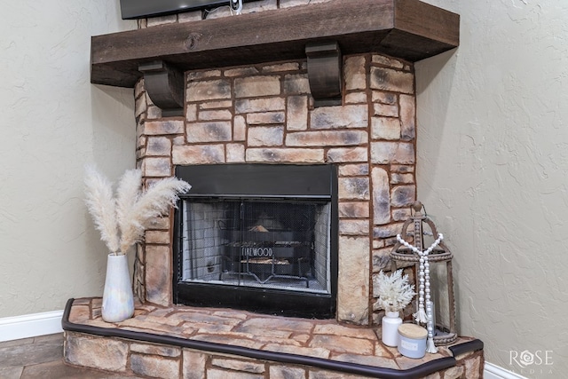 5922 Tarin St, San Angelo, TX 76904 - detailed view of baseboards and a stone fireplace
