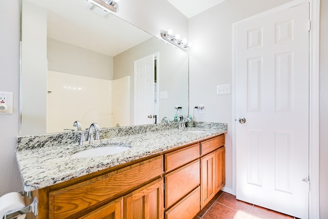 bathroom with vanity and tile patterned flooring