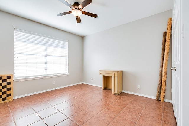 unfurnished room featuring light tile patterned floors and ceiling fan