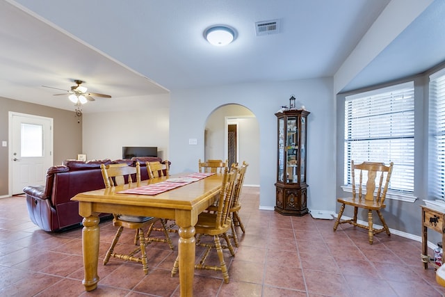 dining area with tile patterned flooring and ceiling fan