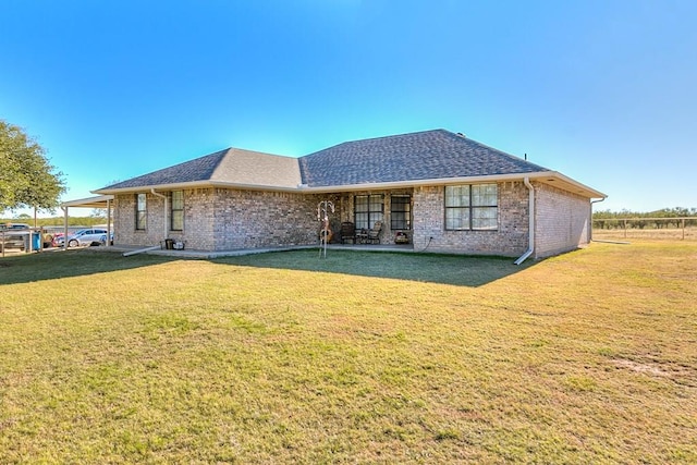 back of house with a yard