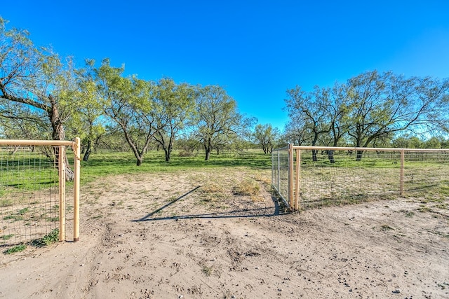 view of gate featuring a rural view