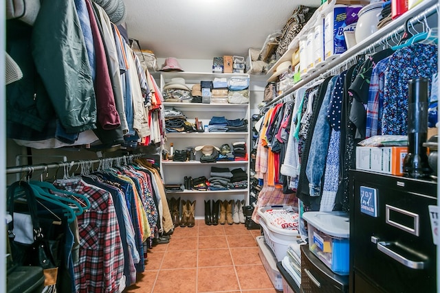 spacious closet with tile patterned floors