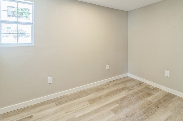 spare room with light hardwood / wood-style flooring