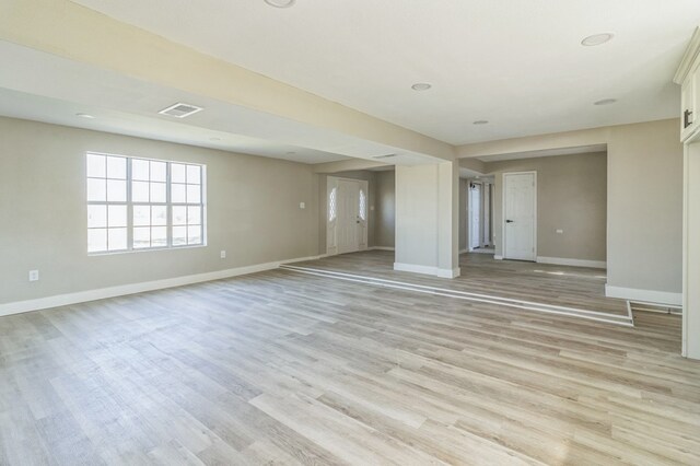 unfurnished room with light hardwood / wood-style floors