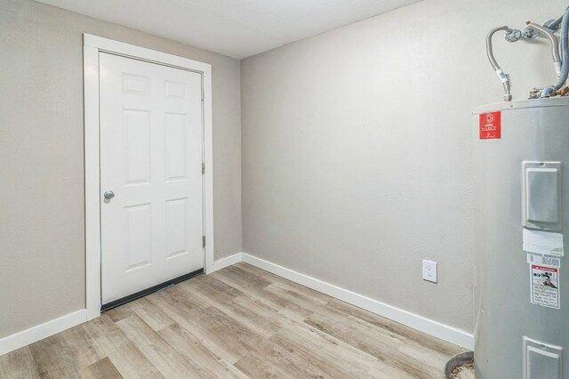 interior space with water heater and light wood-type flooring