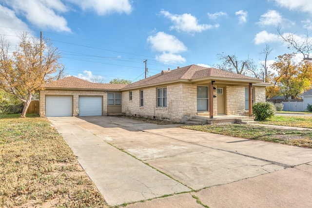 ranch-style home featuring a garage