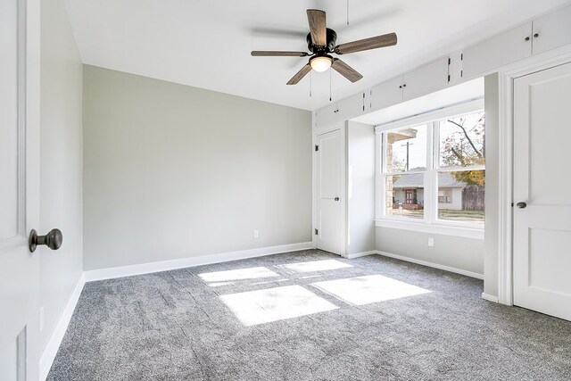 unfurnished bedroom featuring ceiling fan and light carpet