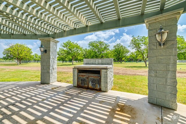 view of patio featuring a pergola