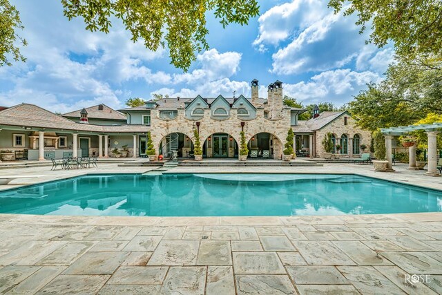 view of pool featuring a pergola and a patio